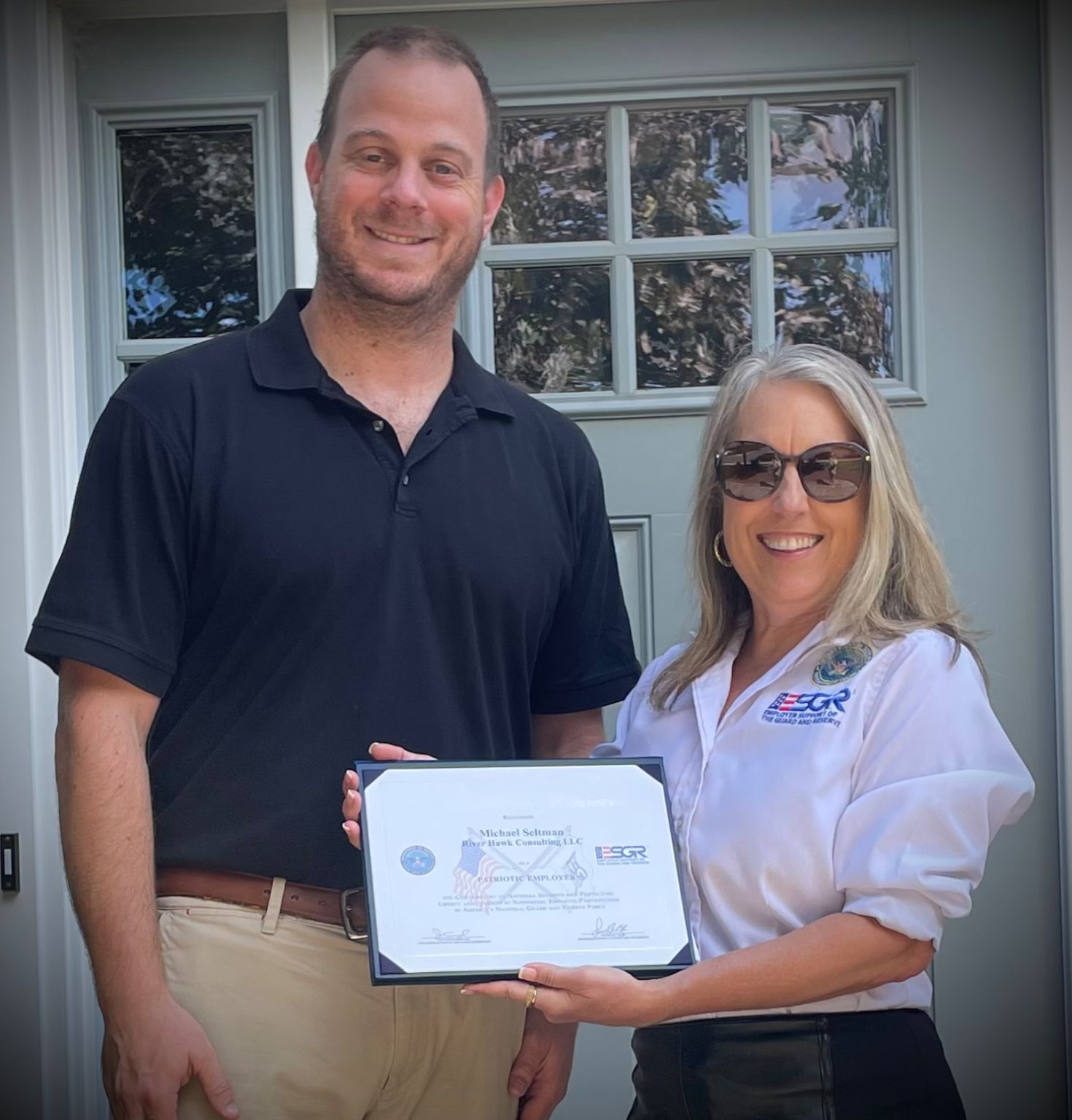 Co-founder Andrew Littman receiving ESGR award