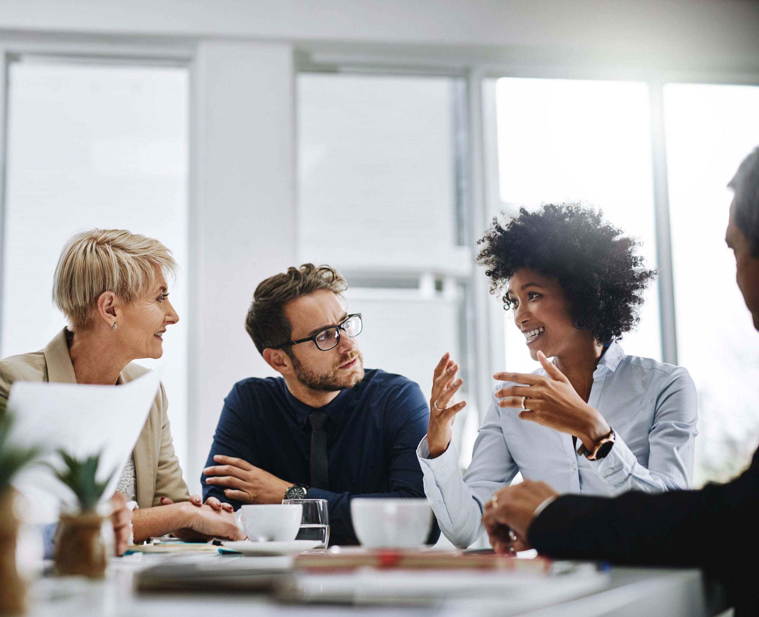 Shot of a group of businesspeople sitting together in a meeting